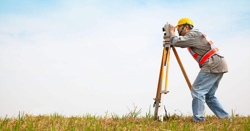 Engineer Surveying Land