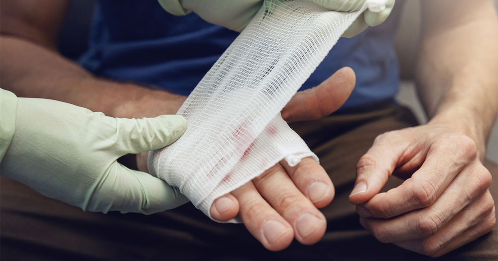 putting-bandage-on-injured-hand