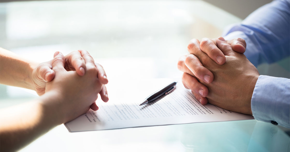 Two business people reviewing document