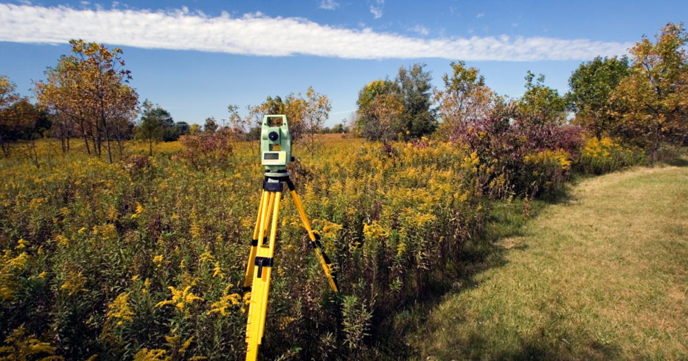 A reflectorless total station in a field.