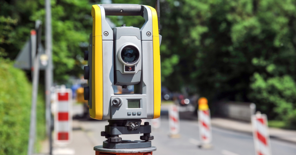 A total station being used for a road project.