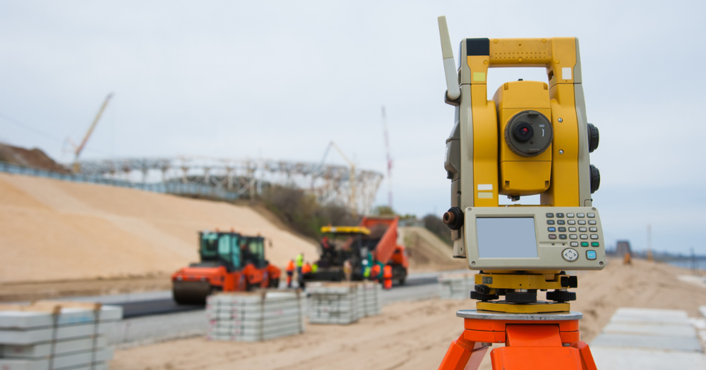 A total station taking a survey at a construction project.